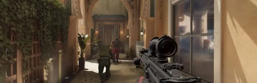 First-person perspective of a soldier holding a rifle in a sunlit courtyard from Delta Force: Hawk Ops.